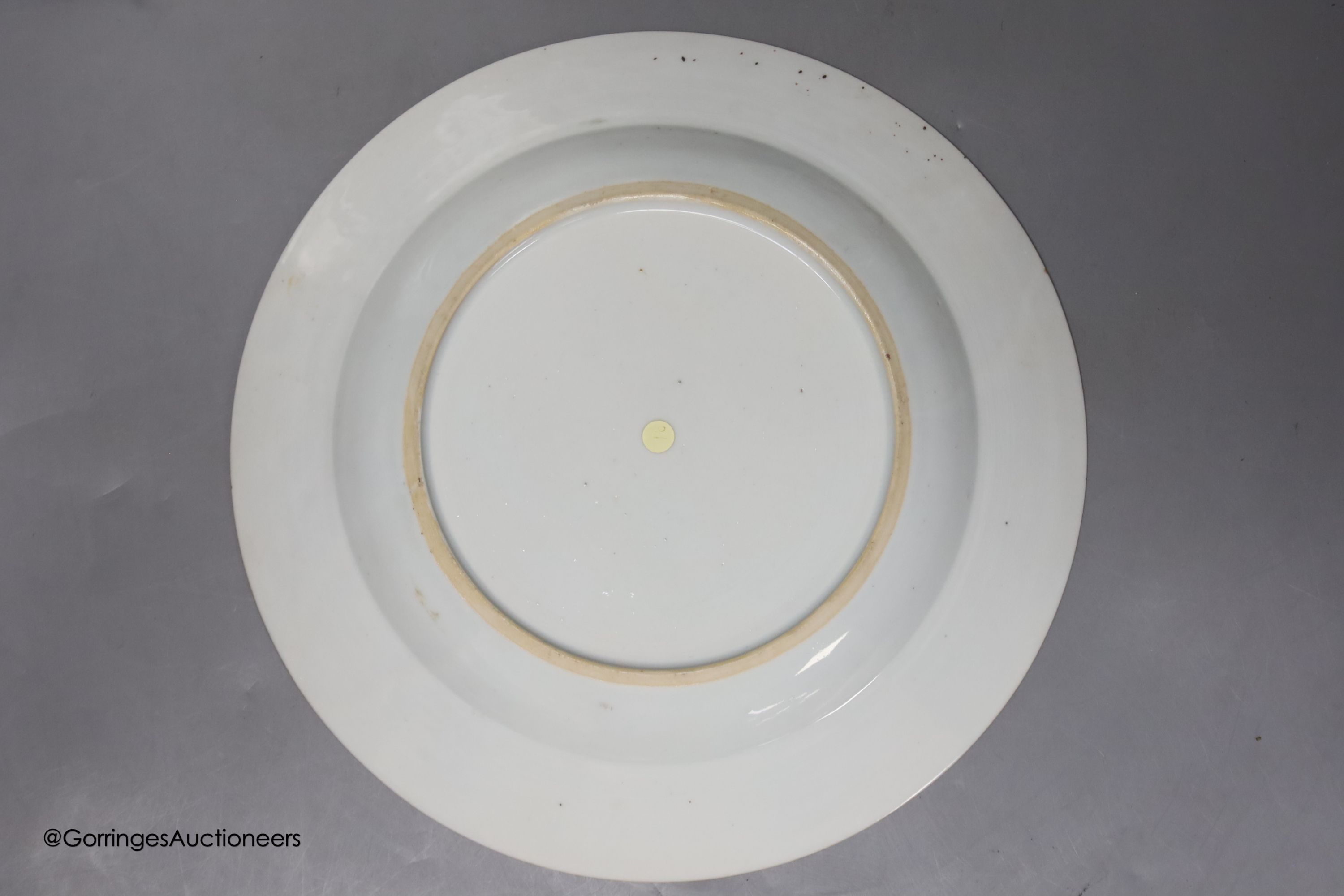 A pair of 18th century Chinese famille rose plates and another similar, largest diameter 22.5cm (damage)